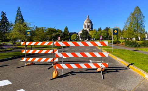 Barricades indicate a closed road on the Capitol Campus.