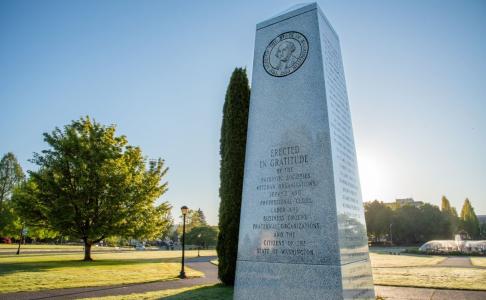 The Washington State Medal of Honor Memorial, with a green expanse of lawn in the background.