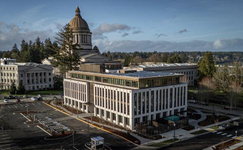 An aerial view of the Newhouse Building and the Legislative Building dome. Parts of the Cherberg Building and the West Capitol Campus lawn are visible.