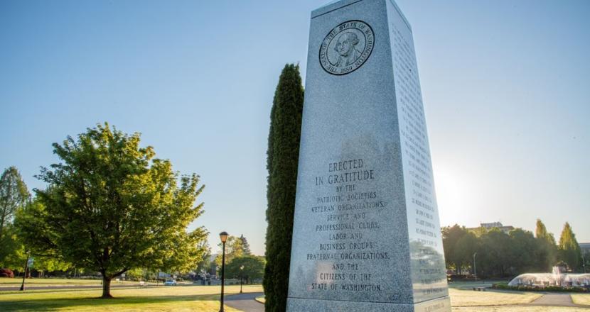 The Washington State Medal of Honor Memorial, with a green expanse of lawn in the background.