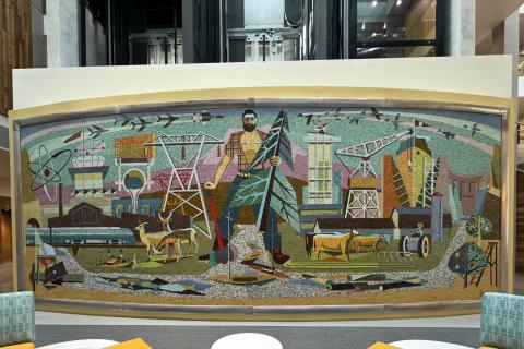 A wide shot of the colorful Beall mosaic mural, which features imagery highlighting Washington state's agriculture, lumber, and science industries.