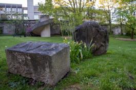 The Mysteries of Life statue, carved out of limestone, sits in the grassy area below the Transportation building.