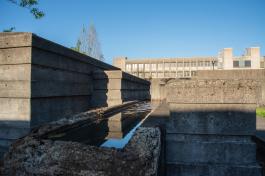 A close-up of one of the concrete walls filled with water inside the Water Garden.