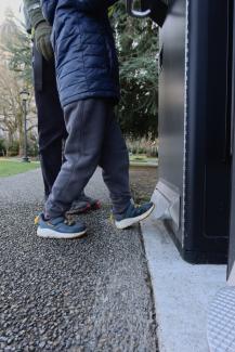 A photo showing a person’s foot depressing the bin’s foot lever.