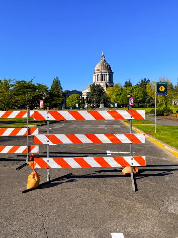 Barricades indicate a closed road on the Capitol Campus.