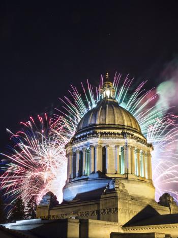 A photo of the Legislative Building with fireworks from Capital Lakefair, July 2016.