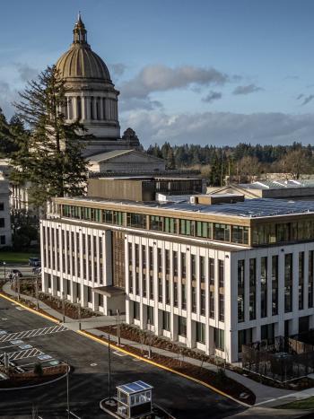 An aerial view of the Newhouse Building and the Legislative Building dome. Parts of the Cherberg Building and the West Capitol Campus lawn are visible.